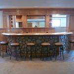 Custom oak bar with stone veneer