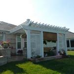 Attached pergola with solid stain, privacy screen and lattice. 