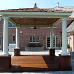 Freestanding pavilion with Ipe decking and cedar shake roof.