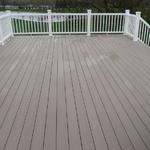 Composite decking with hidden fasteners and composite railing system.