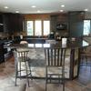 Natural stone tile on island and backsplash